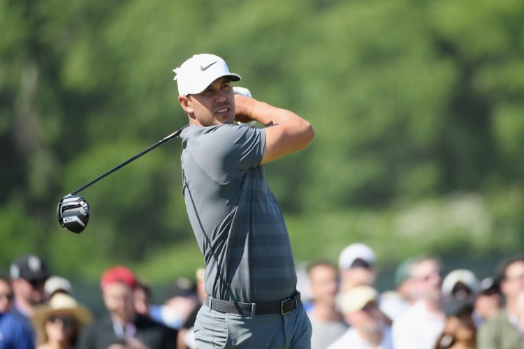 BROOKS KOEPKA of the United States plays his shot during the 2018 U.S. Open at Shinnecock Hills Golf Club in Southampton, New York.