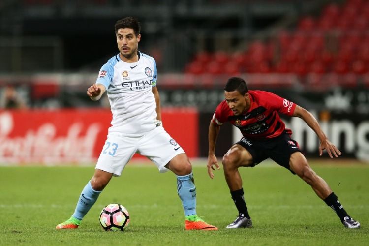 BRUNO FORNAROLI of Melbourne City is challenged by Kearyn Baccus of the Wanderers during the A-League match between the Western Sydney Wanderers and Melbourne City FC at Spotless Stadium in Sydney, Australia.