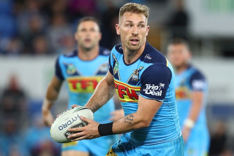 BRYCE CARTWRIGHT of the Titans runs the ball during the NRL match between the Gold Coast Titans and Cronulla Sharks at Cbus Super Stadium in Gold Coast, Australia.