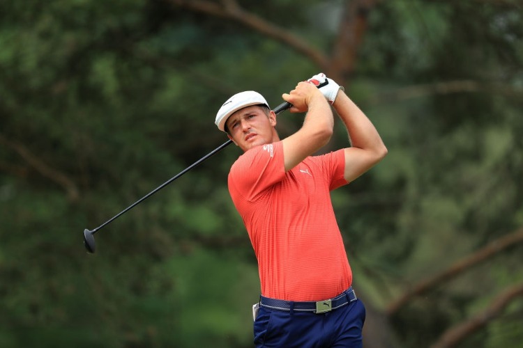 BRYSON DECHAMBEAU watches his tee shot during The Memorial Tournament Presented by Nationwide at Muirfield Village Golf Club in Dublin, Ohio.