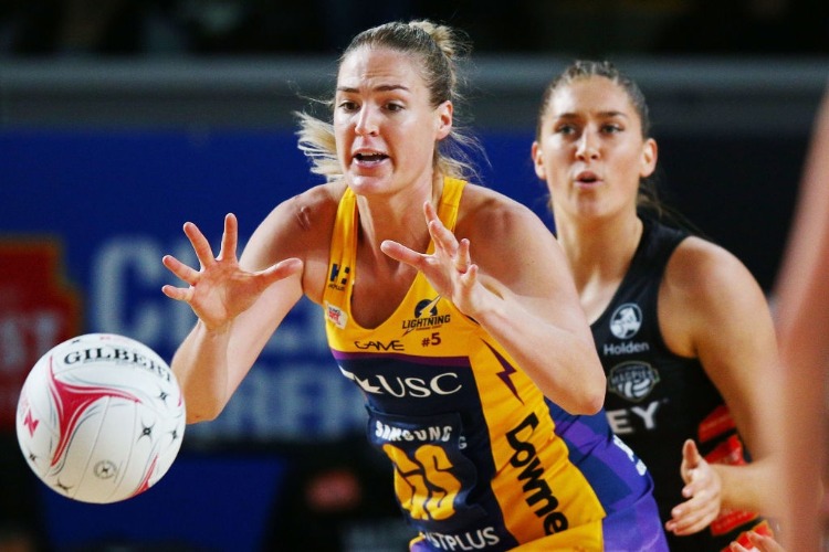 CAITLIN BASSETT of the Lightning gathers the ball during the Super Netball match between the Magpies and the Lightning at Margaret Court Arena in Melbourne, Australia.