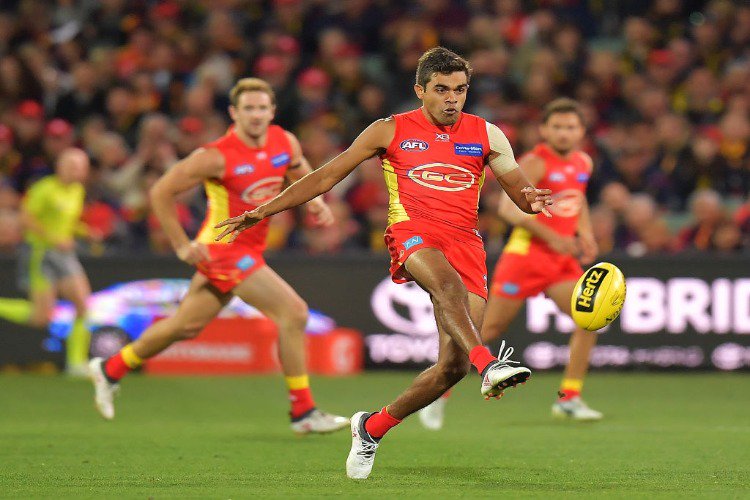 CALLUM AH CHEE of the Suns kicks the ball during the AFL match between the Adelaide Crows and Gold Coast Suns at Adelaide Oval in Adelaide, Australia.