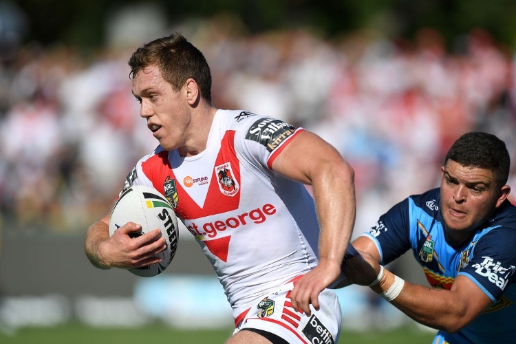 CAMERON MCINNES of the Dragons attempts to break away from the defence during the NRL match between the Gold Coast Titans and the St George Illawarra Dragons at Clive Berghofer Stadium in Toowoomba, Australia.