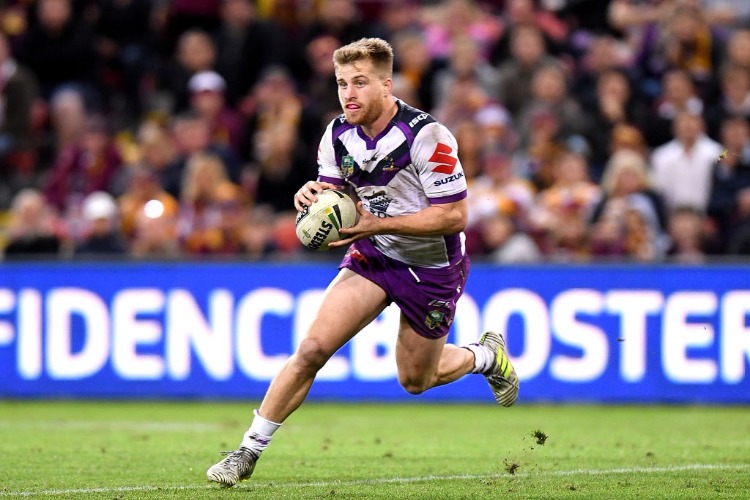 CAMERON MUNSTER of the Storm runs with the ball during the NRL match between the Brisbane Broncos and the Melbourne Storm at Suncorp Stadium in Brisbane, Australia.