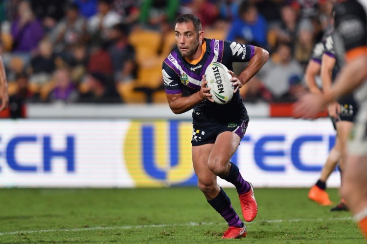 CAMERON SMITH of the Storm charges forward during the NRL match between the Wests Tigers and the Melbourne Storm at Mt Smart Stadium in Auckland, New Zealand.
