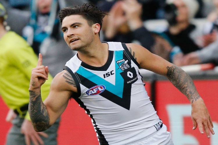 CHAD WINGARD of the Power celebrates a goal during the AFL match between the Melbourne Demons and the Port Adelaide Power at MCG in Melbourne, Australia.