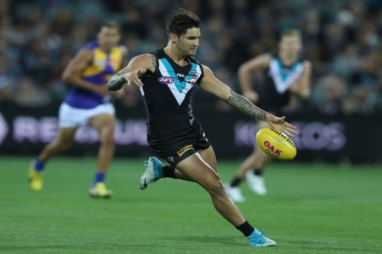 CHAD WINGARD of the Power kicks the ball during the AFL match between the Port Adelaide Power and the West Coast Eagles at Adelaide Oval in Adelaide, Australia.
