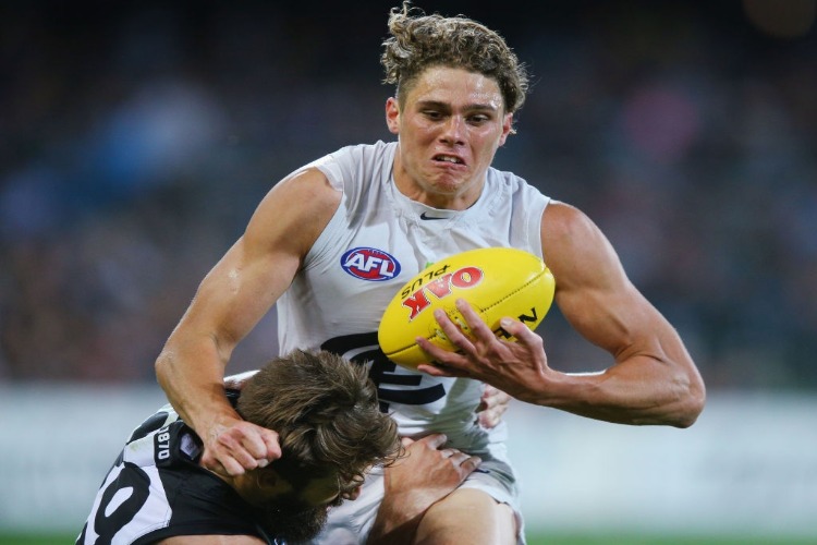 CHARLIE CURNOW of the Blues is tackled by Charlie Dickson of the Power during the AFL match between the Port Adelaide Power and thew Carlton Blues at Adelaide Oval in Adelaide, Australia. CHARLIE CURNOW of the Blues is tackled by Charlie Dickson of the Power during the AFL match between the Port Adelaide Power and thew Carlton Blues at Adelaide Oval in Adelaide, Australia.