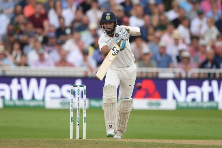 India batsman CHETESHWAR PUJARA drives during the Test Match between England and India at Trent Bridge in Nottingham, England.