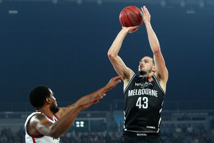 CHRIS GOULDING of Melbourne United (R) shoots during the NBL Grand Final series between Melbourne United and the Adelaide 36ers at Hisense Arena in Melbourne, Australia.