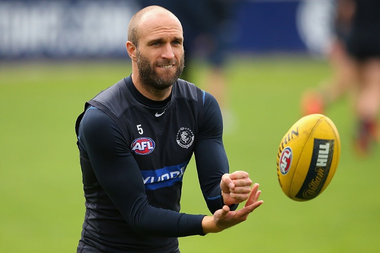CHRIS JUDD of the Blues handballs during a Carlton Blues AFL media session at Ikon Park in Melbourne, Australia. CHRIS JUDD of the Blues handballs during a Carlton Blues AFL media session at Ikon Park in Melbourne, Australia.