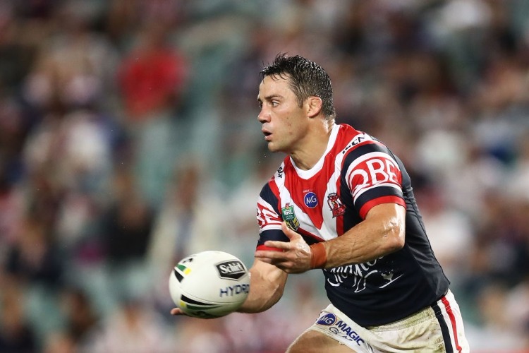 COOPER CRONK of the Roosters passes the ball during the NRL match between the Sydney Roosters and the Newcastle Knights at Allianz Stadium in Sydney, Australia.