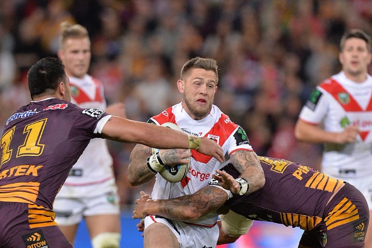 CRAIG GARVEY of the Dragons is tackled during the round 23 NRL match between the Brisbane Broncos and the St George Illawarra Dragons i