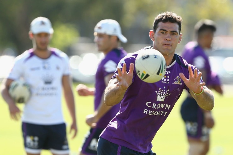 DALE FINUCANE receives the ball during the Melbourne Storm NRL training session at Gosch's Paddock in Melbourne, Australia.