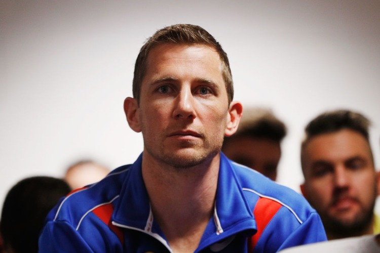 DALE MORRIS listens as Matthew Boyd speaks to media after announcing his retirements during a Western Bulldogs AFL press conference at Whitten Oval in Melbourne, Australia.