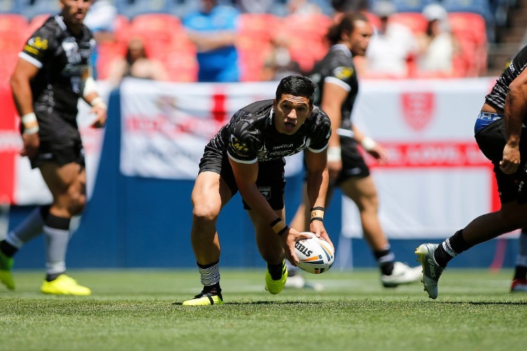 DALLIN WATENE-ZELEZNIAK of New Zealand passes the ball during a Rugby League Test Match between England and the New Zealand Kiwis at Sports Authority Field at Mile High in Denver, Colorado.