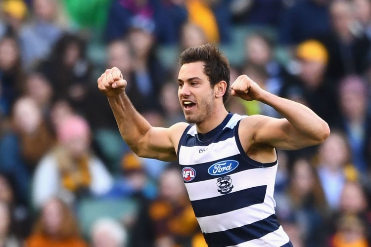 DANIEL MENZEL of the Cats celebrates kicking a goal during the AFL match between the Geelong Cats and the Hawthorn Hawks at MCG in Melbourne, Australia.