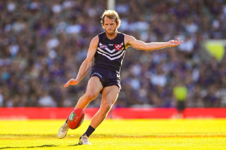 DAVID MUNDY of the Dockers kicks the ball during the 2017 AFL match between the Fremantle Dockers and the Essendon Bombers at Domain Stadium in Perth, Australia.