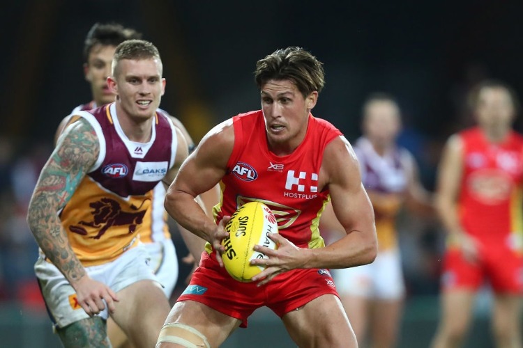 DAVID SWALLOW of the Suns in action during AFL match between the Gold Coast Suns and Brisbane Lions at Metricon Stadium in Gold Coast, Australia.