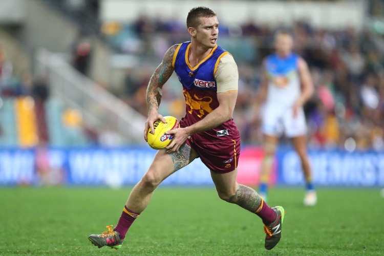 DAYNE BEAMS of the Lions runs the ball during the AFL match between the Brisbane Lions and the Gold Coast Suns at The Gabba in Brisbane, Australia.