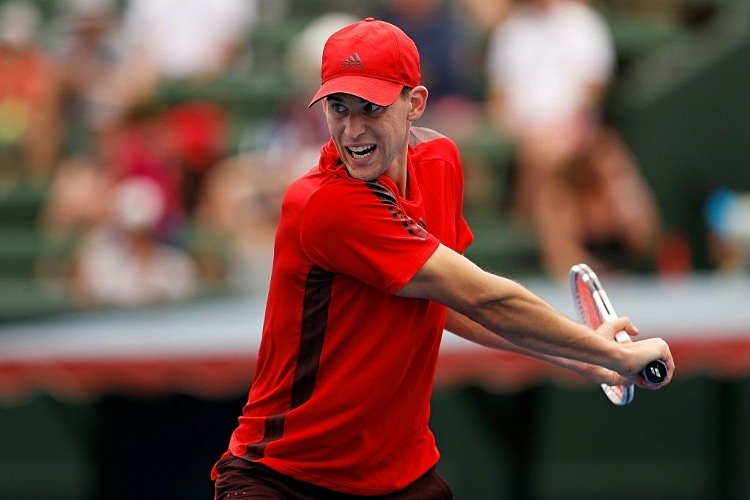 DOMINIC THIEM of Austria plays a backhand against Novak Djokovic of Serbia in the 2018 Kooyong Classic at Kooyong in Melbourne, Australia.