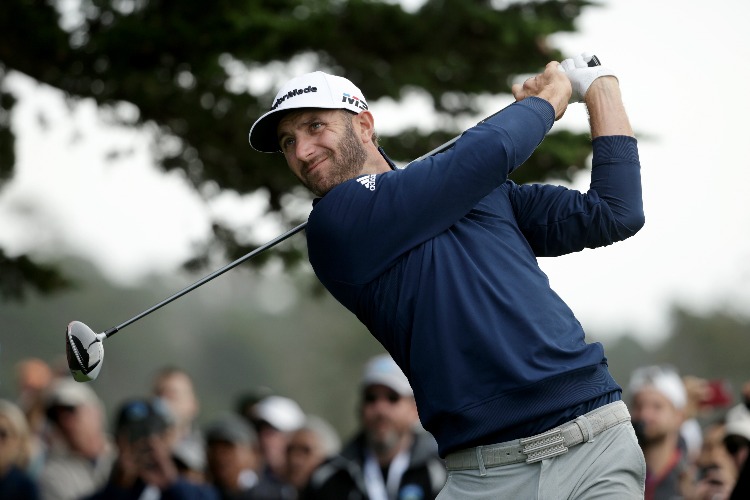 DUSTIN JOHNSON plays his shot during the Final Round of the AT&T Pebble Beach Pro-Am at Pebble Beach Golf Links in Pebble Beach, California.