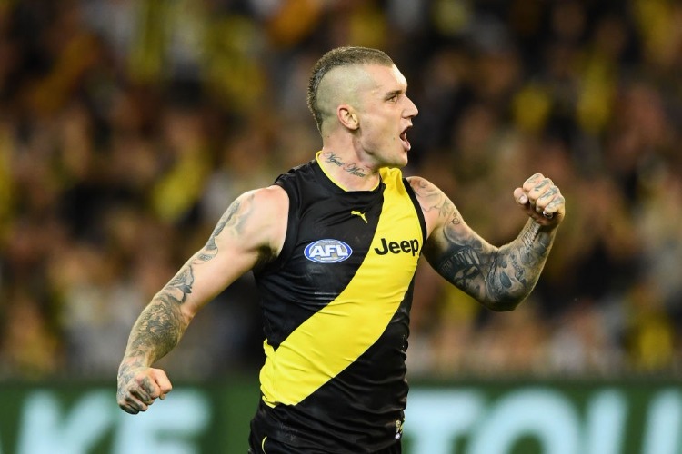 DUSTIN MARTIN of the Tigers celebrates kicking a goal during the AFL match between the Richmond Tigers and the Carlton Blues at MCG in Melbourne, Australia.