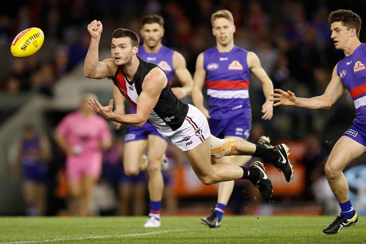 DYLAN ROBERTON of the Saints handpasses the ball during the 2016 AFL match between the Western Bulldogs and the St Kilda Saints at Etihad Stadium in Melbourne, Australia.
