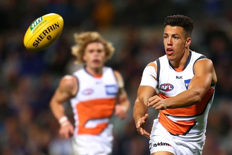 DYLAN SHIEL of the Giants handballs during the AFL match between the Fremantle Dockers and the Greater Western Sydney Giants at Domain Stadium in Perth, Australia.