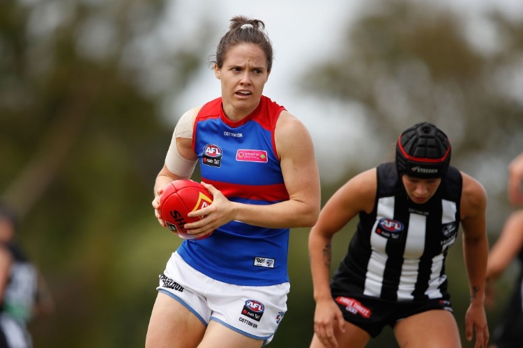 EMMA KEARNEY of the Bulldogs runs with the ball during the AFLW match between the Collingwood Magpies and the Western Bulldogs at TSR in Melbourne, Australia.