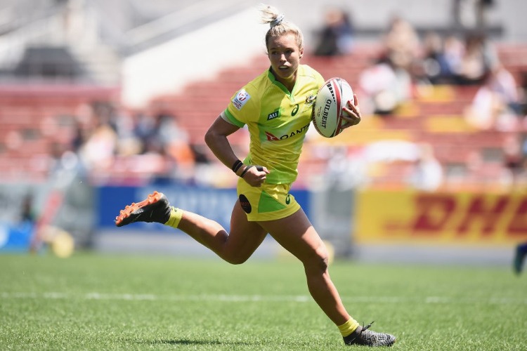 EMMA TONEGATO of Australia runs with the ball on day one of the HSBC Women's Rugby Sevens Kitakyushu Pool match between Australia and China at Mikuni World Stadium Kitakyushu in Fukuoka, Japan. EMMA TONEGATO of Australia runs with the ball on day one of the HSBC Women's Rugby Sevens Kitakyushu Pool match between Australia and China at Mikuni World Stadium Kitakyushu in Fukuoka, Japan.