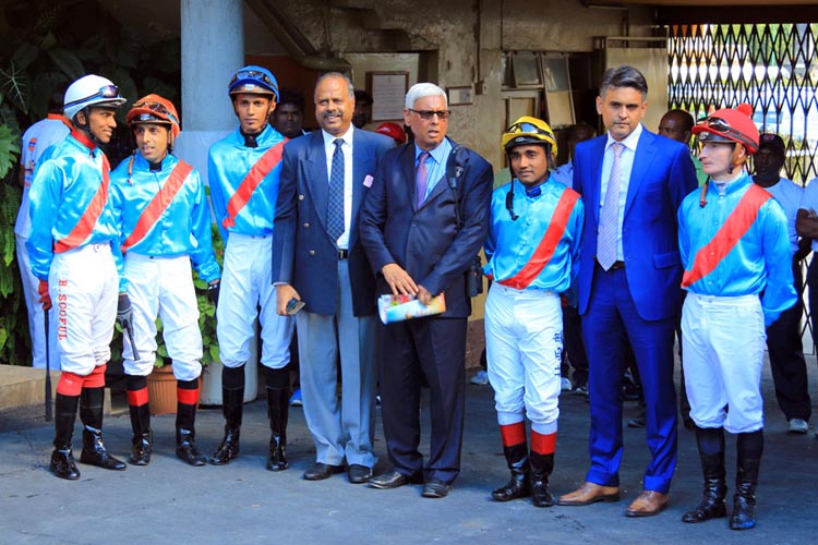 Trainer Soun Gujadhur (fourth from right) and son Mukund (second from right) with their five jockeys. Trainer Soun Gujadhur (fourth from right) and son Mukund (second from right) with their five jockeys.
