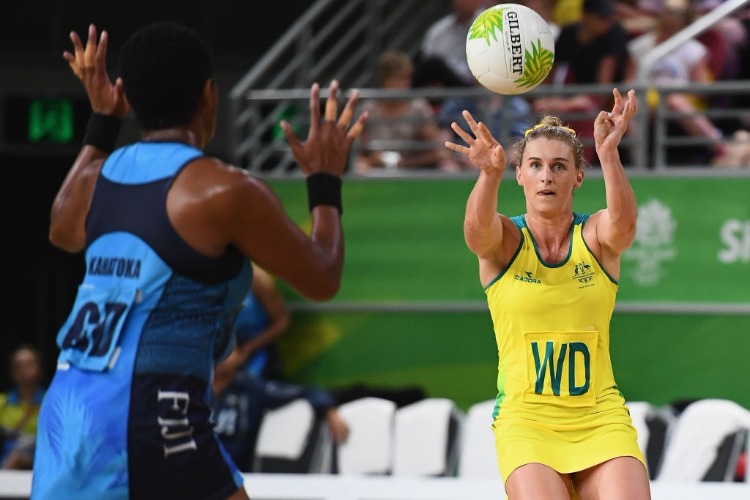 GABI SIMPSON of Australia passes the ball during the Netball Preliminary round match between Fiji and Australia of the Gold Coast 2018 Commonwealth Games at Gold Coast Convention Centre in the Gold Coast, Australia.