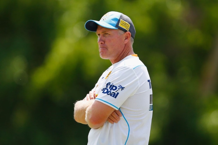 Head Coach GARTH BRENNAN looks on during a Gold Coast Titans NRL training session at Parkwood in Gold Coast, Australia.