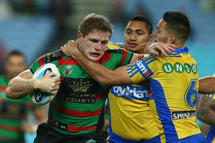 GEORGE BURGESS of the Rabbitohs is tackled during the NRL match between the South Sydney Rabbitohs and the Parramatta Eels at ANZ Stadium in Sydney, Australia.