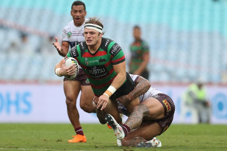 GEORGE BURGESS of the Rabbitohs is tackled during the NRL match between the South Sydney Rabbitohs and the Manly Sea Eagles at ANZ Stadium in Sydney, Australia.