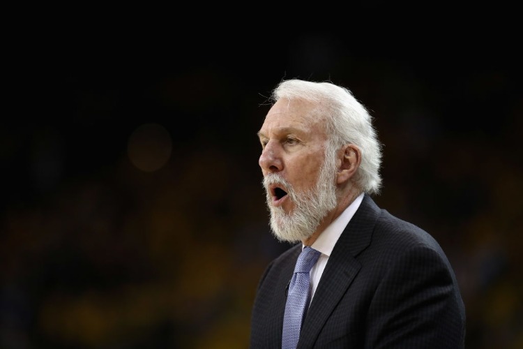 Head coach GREGG POPOVICH of the San Antonio Spurs shouts to his team during their game against the Golden State Warriors in Game 2 of Round 1 of the 2018 NBA Playoffs at ORACLE Arena in Oakland, California. Head coach GREGG POPOVICH of the San Antonio Spurs shouts to his team during their game against the Golden State Warriors in Game 2 of Round 1 of the 2018 NBA Playoffs at ORACLE Arena in Oakland, California.