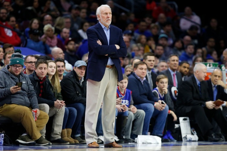 Head coach GREGG POPOVICH of the San Antonio Spurs follows the game against the Philadelphia 76ers in the first half at Wells Fargo Center in Philadelphia, Pennsylvania.