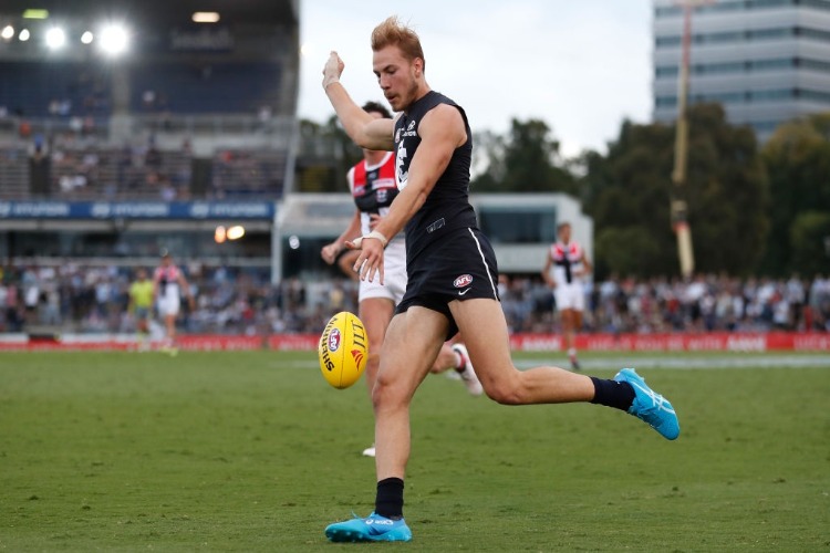 HARRY MCKAY of the Blues kicks the ball during the AFL JLT Community Series match between the Carlton Blues and the St Kilda Saints at Ikon Park in Melbourne, Australia.