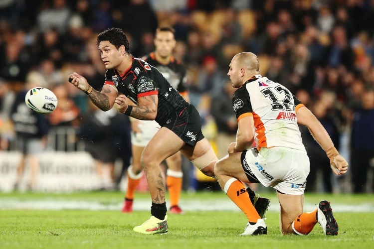 ISSAC LUKE of the Warriors passes the ball out during the NRL match between the New Zealand Warriors and the Wests Tigers at Mt Smart Stadium in Auckland, New Zealand.