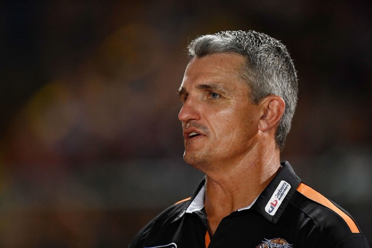 Tigers coach IVAN CLEARY looks on before the start of the NRL trial match between the North Queensland Cowboys and the Wests Tigers at Barlow Park in Cairns, Australia.