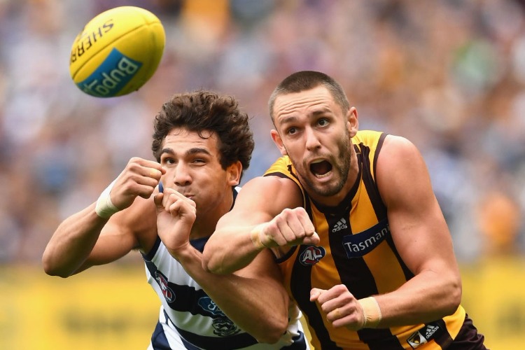NAKIA COCKATOO of the Cats and JACK GUNSTON of the Hawks compete for the ball during the AFL match between the Hawthorn Hawks and the Geelong Cats at MCG in Melbourne, Australia.