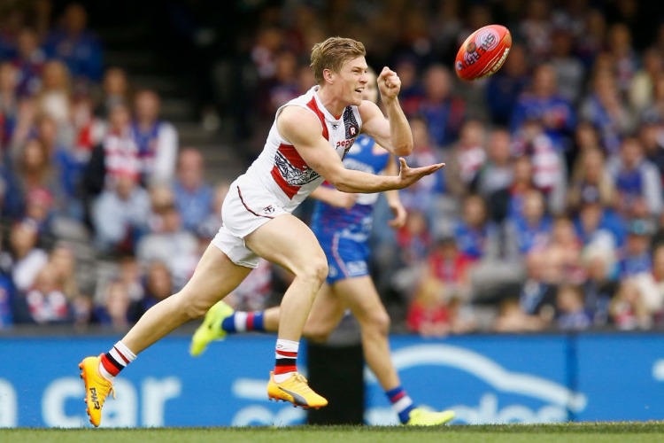 JACK NEWNES of the Saints handballs during the AFL match between the Western Bulldogs and the St Kilda Saints at Etihad Stadium in Melbourne, Australia.