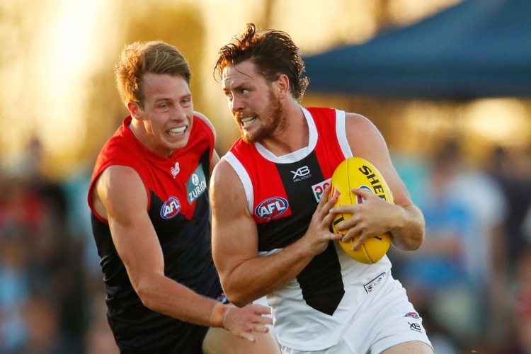 JACK STEVEN of the Saints runs with the ball during the JLT Community Series AFL match between the Melbourne Demons and the St Kilda Saints at Casey Fields in Melbourne, Australia.