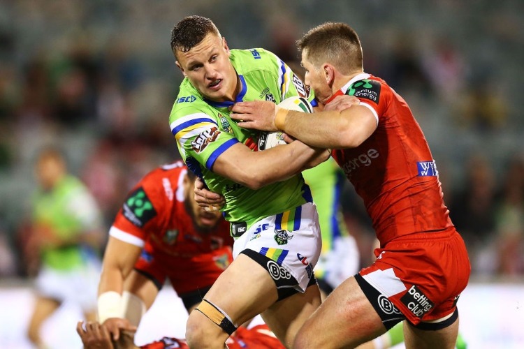 JACK WIGHTON of the Raiders is tackled during the NRL match between the Canberra Raiders and the St George Illawarra Dragons at GIO Stadium in Canberra, Australia.
