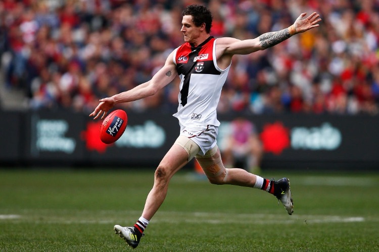 JAKE CARLISLE of the Saints kicks the ball during the AFL match between the Melbourne Demons and the St Kilda Saints at MCG in Melbourne, Australia.