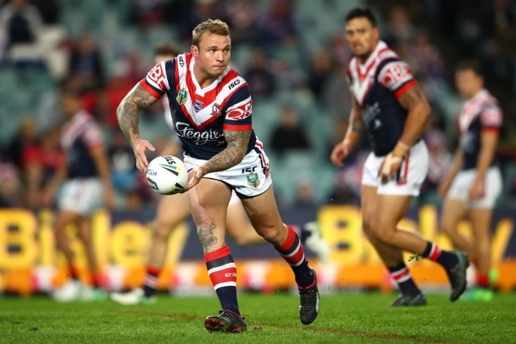 JAKE FRIENDd of the Roosters passes the ball during the NRL match between the Sydney Roosters and the South Sydney Rabbitohs at Allianz Stadium in Sydney, Australia.