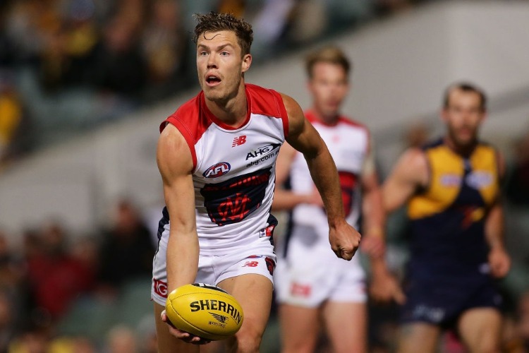 JAKE MELKSHAM of the Demons looks to pass the ball during the AFL match between the West Coast Eagles and the Melbourne Demons at Domain Stadium in Perth, Australia. JAKE MELKSHAM of the Demons looks to pass the ball during the AFL match between the West Coast Eagles and the Melbourne Demons at Domain Stadium in Perth, Australia.