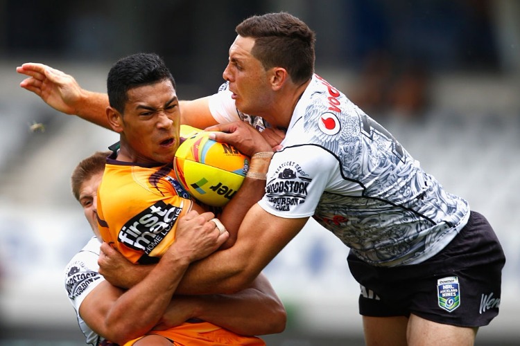 JAMAYNE ISAAKO of the Broncos is tackled by Jonathan Wright of the Warriors during the 2016 Auckland Nines match between the New Zealand Warriors and the Brisbane Broncos at Eden Park in Auckland, New Zealand.