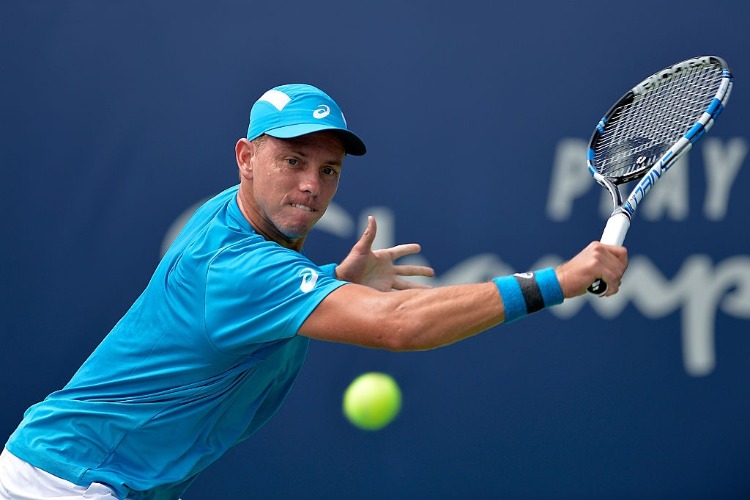 JAMES DUCKWORTH of Australia returns a shot to Petros Chrysochos of Cyprus during the Winston-Salem Open at Wake Forest University in Winston Salem, North Carolina.